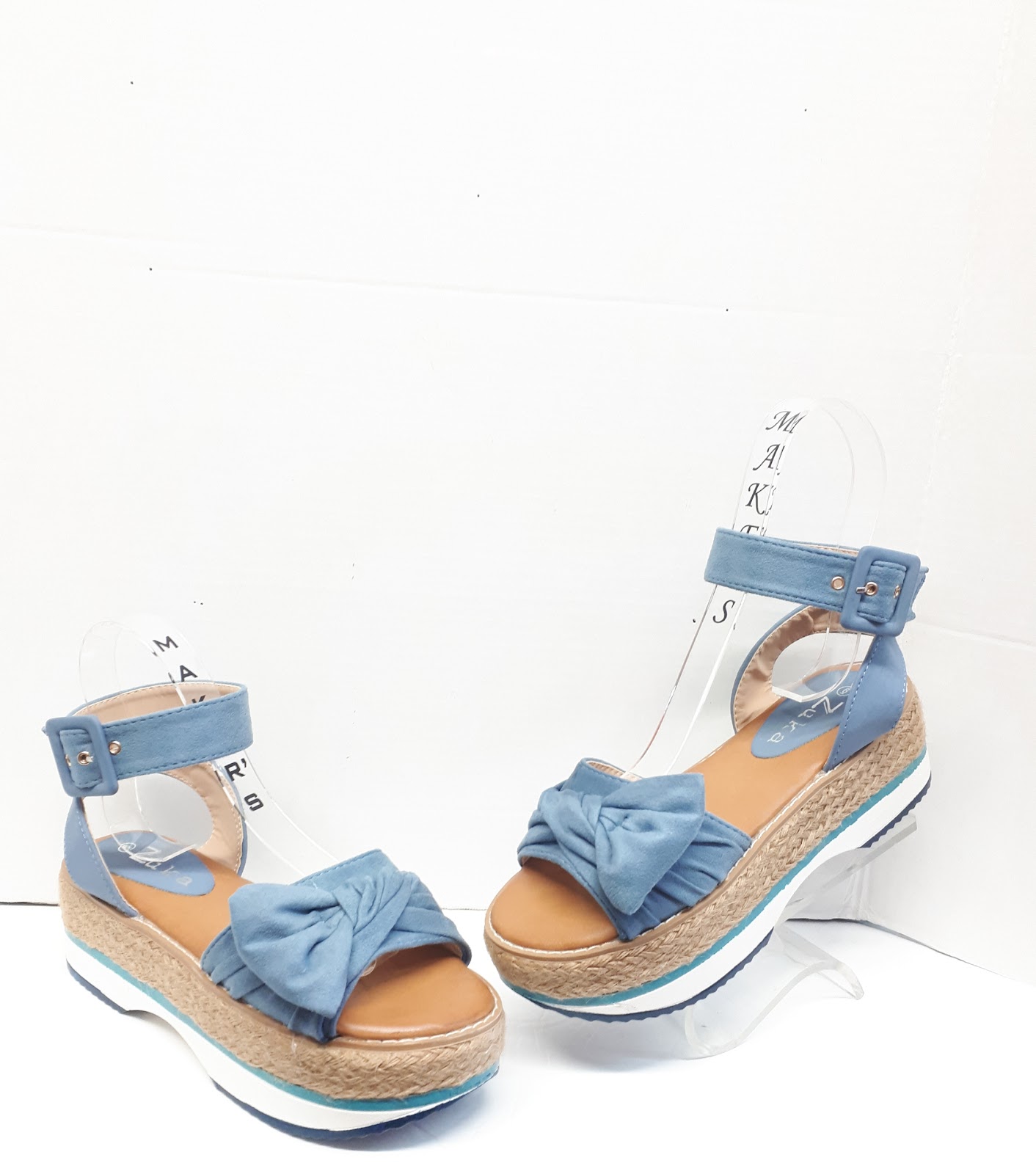 Shoes From 5 AERO Ion sneaker floating on a dark studio pedestal with cyan glow